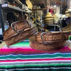 Really nice men's western cowboy belt perfect for any occasion! Artisan engraved leather belt with a rodeo and cowboy design. Has a 1.5 inch width made from 100% genuine leather. Solid finish with stainless steel hardware great for a life lasting touch. Great to combine and style to your preference as well to wear during any activity. Made 100% from Mexico available in all sizes 30-44!  Wondering What Belt Size To Get?  Usually belt sizes are 4 sizes above your pants/ waist size. (Ex): If you ar Western Style Adjustable Belts For Western-themed Events, Adjustable Hand Tooled Belts For Rodeo, Western Belt Buckles For Rodeo, Engraved Western Belt Buckles For Rodeo, Engraved Western Belt Buckles For Western-themed Events, Western Engraved Belts For Rodeo, Engraved Western Belt For Ranch, Western Style Engraved Belts For Rodeo, Western Style Engraved Belt For Ranch