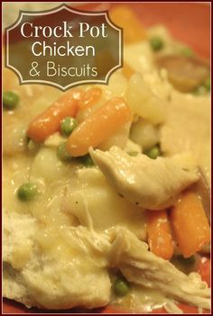 crock pot chicken and biscuits with peas, carrots and peas on top