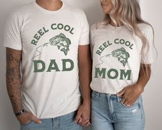 two people standing next to each other wearing t - shirts that read reel cool, reel mom