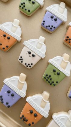 decorated cookies in the shape of cupcakes with frosting