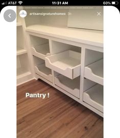 there is a white shelf with drawers in the corner and an advertise that reads pantry