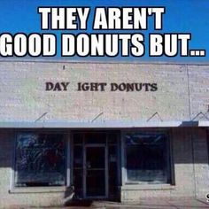 the front of a donut shop that says they aren't good donuts but day light donuts