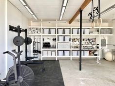 a gym with several exercise equipment and storage shelves in the back ground, including an exercise bike