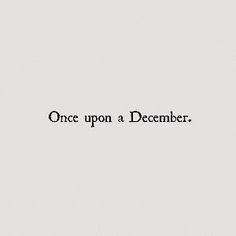 the words once upon a december written in black ink on a white sheet of paper