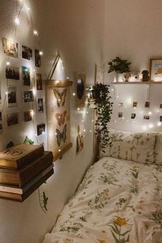 a bedroom with lights and pictures on the wall