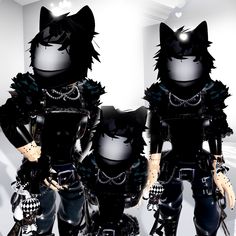 three black cats are dressed up in goth clothes and chains, all standing next to each other