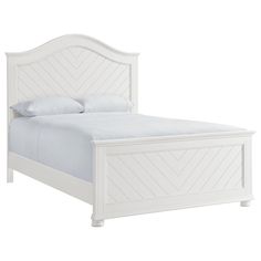 a white bed with an upholstered headboard and foot board on the side