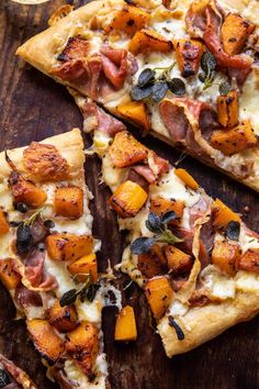 two slices of pizza sitting on top of a wooden cutting board