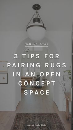 a hallway with the words 3 tips for pairing rugs in an open concept space