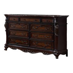 an antique dresser with many drawers and carvings on the top, in dark brown wood