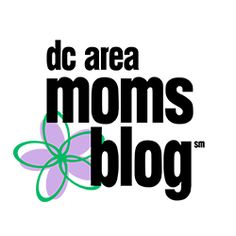 the knoxville moms blog logo with an orange and blue flower on it