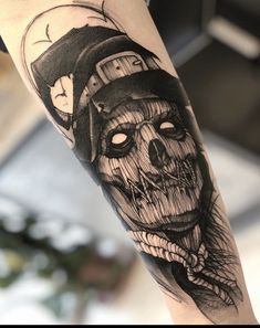 a person with a clock and skull tattoo on their arm