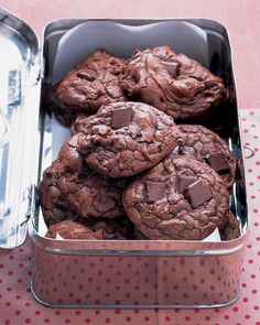 chocolate cookies in a tin on a table