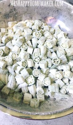 a bowl filled with white marshmallows on top of a table