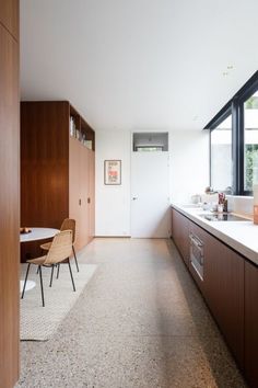 the kitchen is clean and ready to be used as a dining room or office space