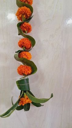 an arrangement of orange flowers arranged in a row