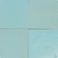 four square pieces of light blue paper with white squares