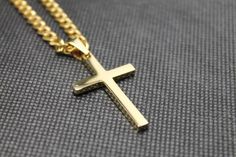 FlowX 18K Gold Plated Cross PendantOur stainless steel 18K gold plated cross necklace is a classic look that you will love.These cross pendants are 316L stainless steel plated in 18K gold and polished to a mirror shine!  Our 40mm crosses come with a 3mm box chain.  Our 30mm crosses come with a 2mm box chain.Cross size options:40MM in height and 25MM in width(bigger) + 3mm box chain included30MM in height and 16MM in width(smaller) + 2mm box chain includedFREE shipping in the USA!  FlowX orders s Cross Necklace Simple, Cross Necklace Gold, Mens Cross Necklace, Stainless Steel Cross Pendant, Simple Cross, Steel Cross, Mens Crosses, Gold Cross Necklace, Gold Cross Pendant