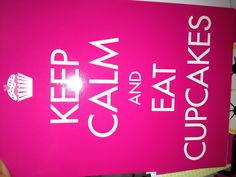 a pink sign that says keep calm and eat cupcakes