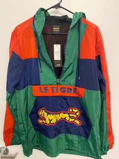 Le TIGRE Jacket Windbreaker Green Multi Color  Men's Size Medium  NEW WITH TAGS FREE SHIPPING USA SHIPPING ONLY Casual Green Sport Coat For Streetwear, Green Sport Coat With Pockets For Streetwear, Streetwear Green Sport Coat With Pockets, Multicolor Long Sleeve Color Block Windbreaker, Sporty Multicolor Patchwork Windbreaker, 90s Patchwork Windbreaker For Outdoor, Vintage Multicolor Fall Windbreaker, Yellow Vintage Long Sleeve Windbreaker, Tags