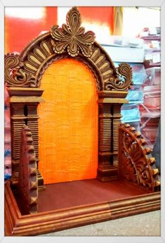 an elaborately carved wooden structure with orange walls