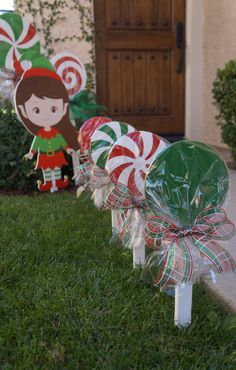 some candy canes are sitting on the grass