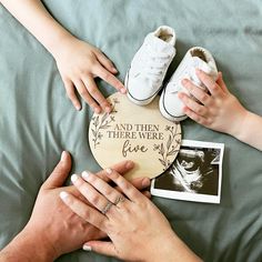 two people holding hands over a plaque that says and then there we are five on it