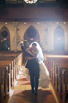 the bride and groom are walking down the aisle