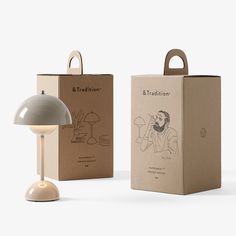 a table lamp sitting next to a cardboard box