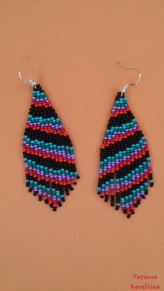 These handmade author's earrings are made of high-quality Czech beads and strong synthetic thread.In these unique earrings I use my author's scheme . Color: black,turquoise, green, purple, red, orange. I will make these earrings for you in your color. 100% hand made with love! Measurements: Length with hook -9,5 cm ( 3.74 inch ),Width -3 cm (1.18 inch) Materials: Silver plated ear hooks Czech glass beads Tytan Thread Black Earrings With Tiny Round Beads, Handwoven Black Drop Earrings, Black Handwoven Drop Earrings, Black Drop Earrings With Colorful Beads, Handwoven Black Earrings For Gifts, Black Handwoven Dangle Jewelry, Handwoven Black Jewelry With Round Beads, Black Handwoven Round Beads Jewelry, Traditional Black Beaded Earrings With Round Beads