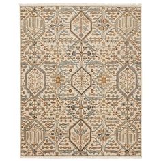 a beige and blue rug with an intricate design on the bottom, in different colors