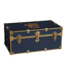 a large blue trunk with gold trimmings and an emblem on the lid is shown