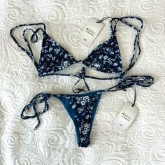 This Modern Double Strap Bikini Is The Perfect Way To Update The Look Of Your Swimwear Collection. The Floral Pattern Is A Fun And Sophisticated Look That Will Flatter A Wide Variety Of Different Skin Tones. The Adjustable Back Tie Is Great For Customizing The Fit And Ensures A Secure Fit That Won't Come Undone. The Eco-Friendly Materials Ensure You Don't End Up With Any Toxic Residue. This Bikini Top Is A Great Way To Add A Fun And Fashionable Flair To Any Look. Brand: Celia Swimwear Italian Ca Fitted Swimwear With Tie-side Bottom For Summer, Fitted Summer Swimwear With Tie-side Bottom, Fitted Tie-side Bottom Swimwear For Summer, Fitted Tie-side Bottom For Beach Party, Fitted Floral Print Swimwear With Triangle Top, Fitted Floral Print Triangle Top Swimwear, Fitted Bra Friendly Swimwear For Vacation, Fitted Bra-friendly Swimwear For Vacation, Fitted Floral Print Tie-side Swimwear