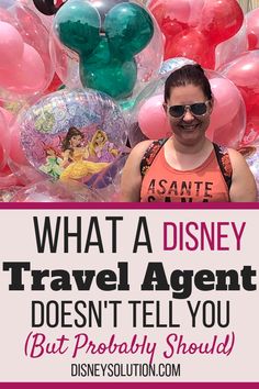 a woman standing in front of balloons with the words, what a disney travel agent doesn't tell you but probably should