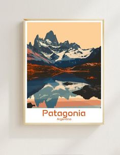 a poster with the name patagonia in front of a mountain range and lake