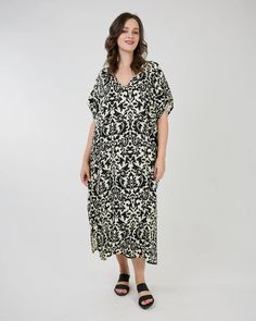 The Helen Caftan by Shannon Passero Style#: 5095 One Size Measurement Across Chest: 32" Length from Shoulder: 50" 100% Rayon-Woven Our small group of prints are made with care by our Women’s Co-Op in Thailand.The prints are limited runs to be mindful of limiting our fabric waste.Designed in Canada | Made in Thailand Black Printed Short Sleeve Kaftan, Black Printed V-neck Kaftan, Black Printed Kaftan With Short Sleeves, Casual V-neck Patterned Kaftan, Black Floral Print Maxi Kaftan, Black Printed Tunic Kaftan, Floral Print Patterned Tunic Kaftan, Daywear V-neck Printed Kaftan, Black Spring Kaftan With Short Sleeves