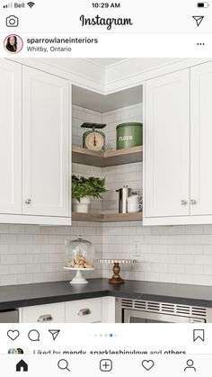 a kitchen with white cabinets and black counter tops is featured on instagram for valentine's day