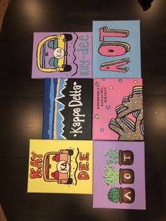 four children's books are laid out on a table with the words love spelled in different languages