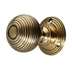 an antique brass door knob on a white background