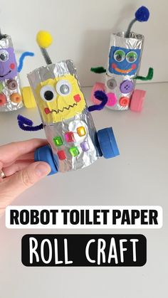 the robot toilet paper roll craft is being held up