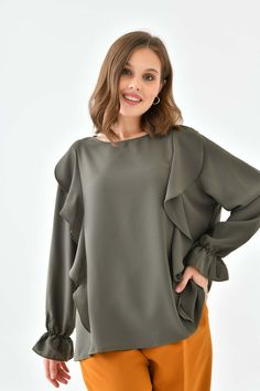 A sharp addition to your wardrobe, the Oversized Frilled Front Blouse with Detailed Cuffs is equal parts comfortable and stylish. This elegant blouse combines a simple designs with expertly placed details to create a striking look! Material: Polyester Color: Khaki Fit: Relaxed Size: Oversized *Model wears UK size 8-10. Product Highlight: ● Oversized fit with details. ● Versatile design. ● Suitable for various occasions. ● Flattering fit. ● A versatile addition to your wardrobe. 💦CARE INSTRUCTIONS: ● Check the care label for instructions. ● Pre-treat stains before washing. ● Machine wash on a gentle cycle with cold water. ● Use a mild detergent suitable for delicate fabrics. ● Avoid bleach and fabric softeners. ● Air dry or use a low heat setting in the dryer. ● Iron on a low-temperature s Product Highlight, Elegant Blouses, Office Fashion, Everyday Wardrobe, Oversized Fits, Womens Clothing Tops, Simple Designs, Care Instructions, Blouses For Women