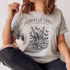 This shirt (Bella Canvas 3001) is unisex and true to size, with a relaxed fit. If you prefer a slimmer fit, consider a smaller size. Morally Grey is my favorite color, and if you're a spicy reader seeking a Funny bookish reading gift for book nerds and bookworms, this is for you! A bookish shirt is the perfect gift idea for book nerds, bookworms, literature teachers, librarians, readers, and writers. Basic Gray Shirt With Graphic Print, Gray Relaxed Fit Shirt With Screen Print, Everyday Gray Cotton Shirt, Morally Grey, Literature Teacher, Bookish Merch, Fictional Men, College T Shirts, Reading Gifts