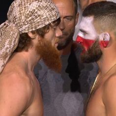 two men with their faces painted like clowns and one is wearing a bandana