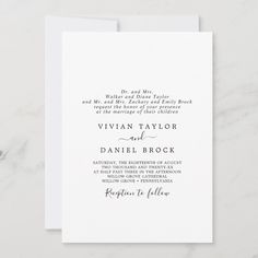 an elegant wedding card with the wording and calligraphy in black ink on white paper