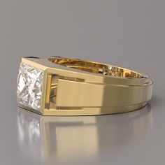 a gold ring with a princess cut diamond in the center, on a reflective surface