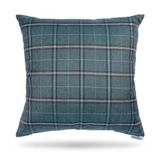 a blue plaid pillow on a white background