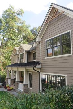 the front of a house with many windows