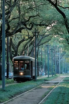 a trolley car is going down the tracks