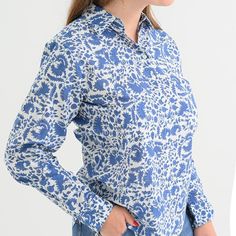 Cobalt blue flowers dance across our classic and versatile button down. Easy to dress up with a pair of white jeans and stiletto sandal, or perfect for casual everyday, with a pair of flats or flip-flops. Tidy up by tucking it in, or stay chilled by leaving it out. Blue Blouse With Button Cuffs For Spring, Summer Workwear Blouse In Indigo, Fitted Indigo Summer Blouse, Fitted Indigo Blouse For Summer, Classic Blue Blouse For Day Out, Chic Indigo Summer Blouse, Chic Indigo Blouse For Spring, Indigo Blouse For Workwear In Spring, Indigo Collared Top For Spring