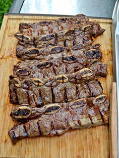 steak on a cutting board being prepared to be grilled